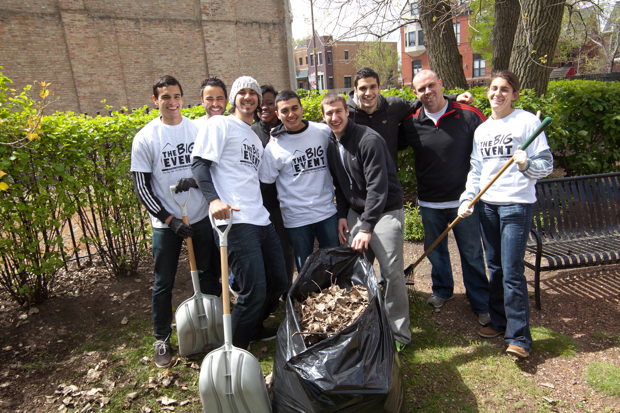 group shoveling leaves.